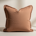 Terracotta fringed linen cushion cover
