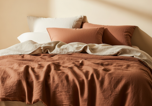 Terracotta clay linen duvet styled on a bed, lifestyle